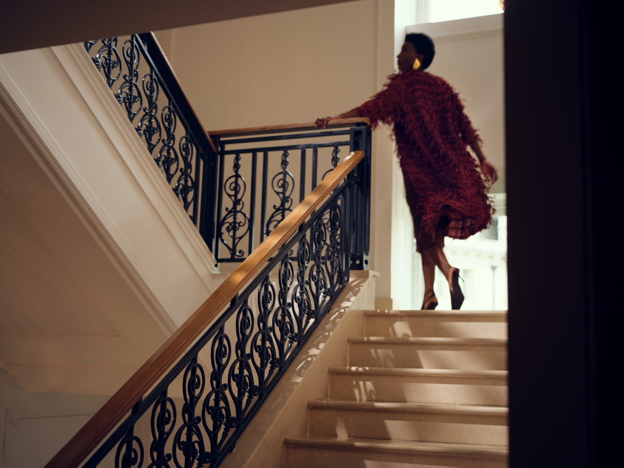 woman with his luxury dress on the stairs